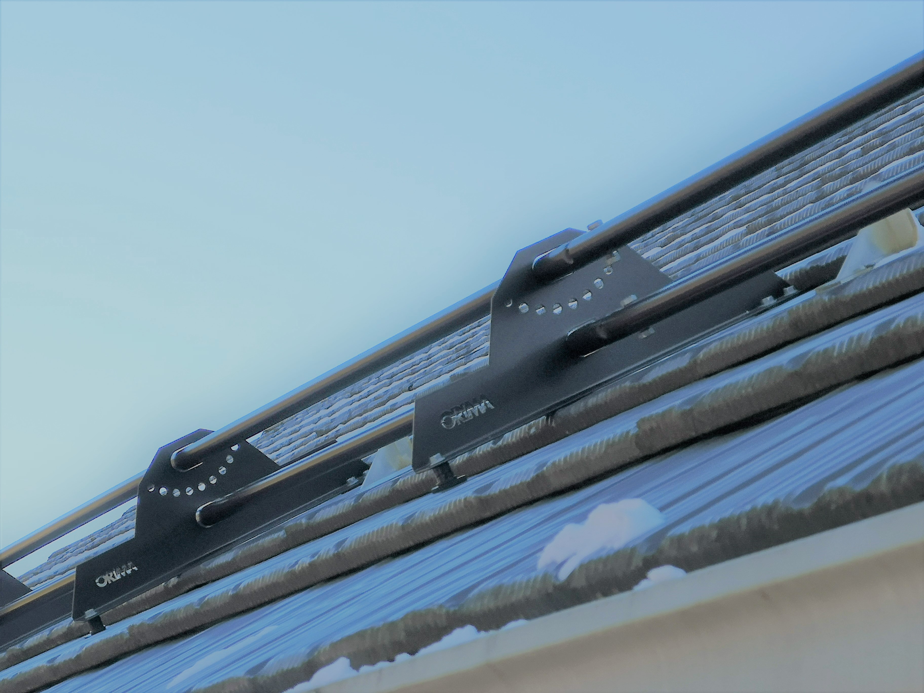Tubular Snow Guards on metal shingles roof